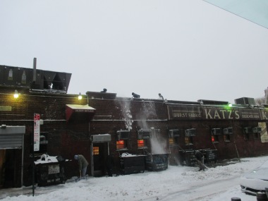 Clearing snow off the roof of Katz's Deli